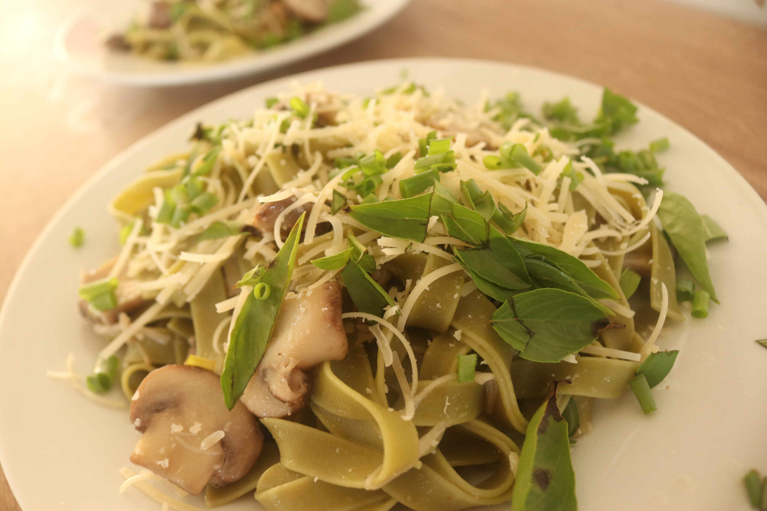 spinach fetuccini with mushrooms - plant-based food at Vida Lotus 