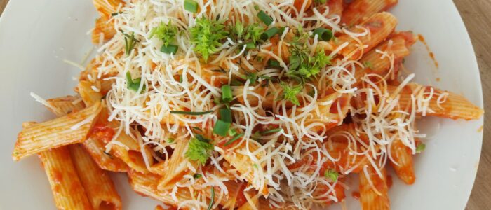 penne pomodoro with vegan parmesan cheese